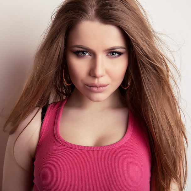 Studio portrait of young sensual & beauty model girl in pink t-shirt. - Foto, imagen