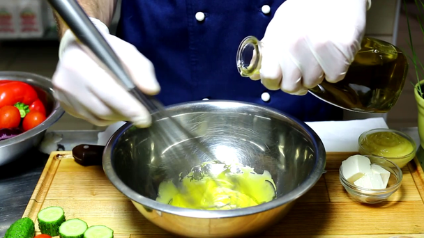 Hands whisking yolk with corolla - Footage, Video