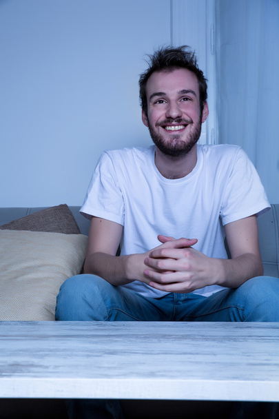 Young man watching TV at nighttime - Fotó, kép