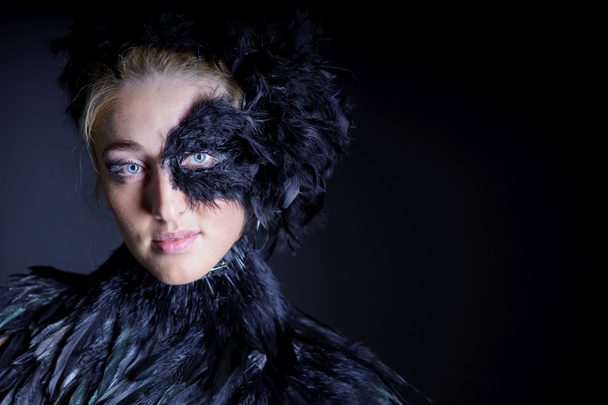 Woman with black feather half mask - Φωτογραφία, εικόνα
