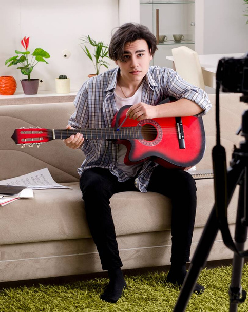 The young guitar player recording video for his blog - Foto, Imagem