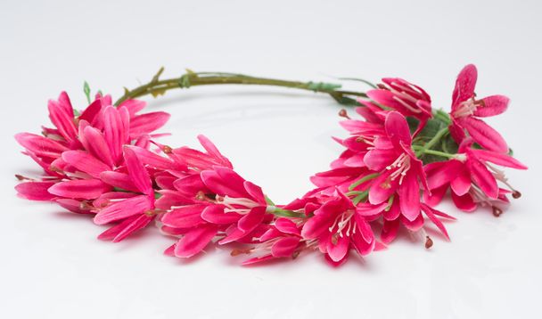 tiara of artificial  roses on a light background - Foto, afbeelding