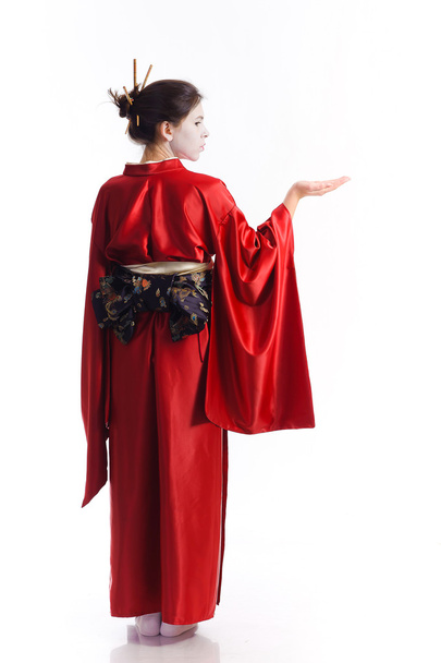 The girl in native costume of japanese geisha - Photo, image