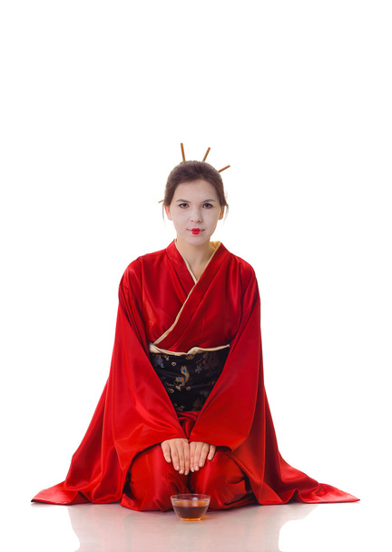 The girl in native costume of japanese geisha - Φωτογραφία, εικόνα