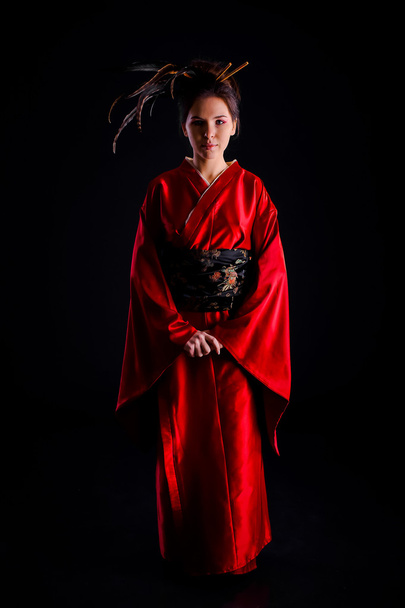 The girl in native costume of japanese geisha - Φωτογραφία, εικόνα
