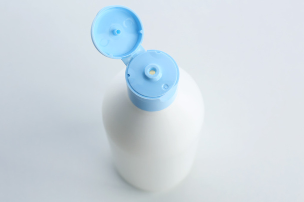 Open cosmetic bottle isolated on white - Photo, Image