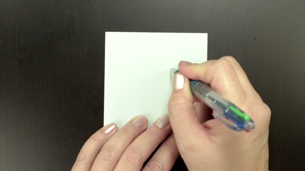Dibujo cara sonriente Triste en papel de nota
 - Metraje, vídeo