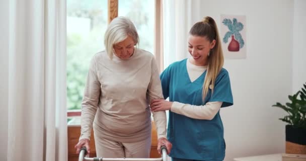Senior, woman and nurse with walker for support, help and healthcare service in retirement home. Elderly, person and caregiver with happiness for mobility, rehabilitation and recovery in living room. - Footage, Video