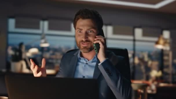 Cheerful businessman talking mobile phone in office closeup. Successful financial manager receive celebrating victory work triumph. Happy man stock trader discuss investment profit on business call  - Footage, Video
