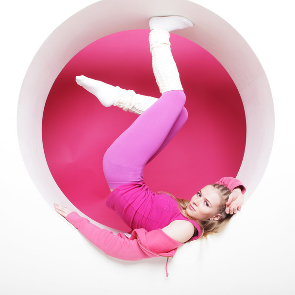 sporty woman posing in pink circle - Φωτογραφία, εικόνα