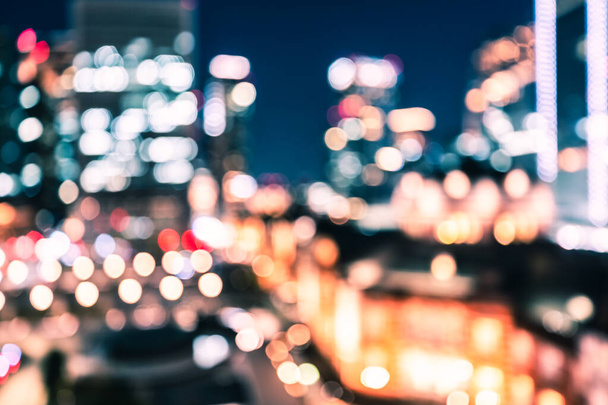 City night bokeh abstract background of Tokyo railway station with modern office building in Tokyo, Japan - Foto, imagen