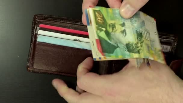 Israeli money are brought out of wallet - Footage, Video