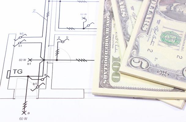 Pico de notas de banco em desenho de construção de casa
 - Foto, Imagem