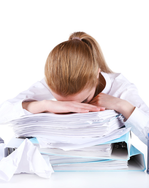 Tired woman at her workplace with documents isolated on white - Zdjęcie, obraz