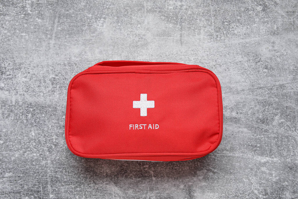 First aid kit on grunge grey background - Photo, Image