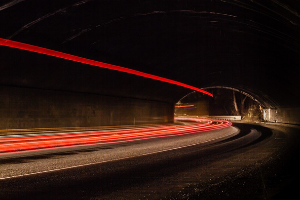 light trails in tunnel. Art image. Long exposure photo taken in  - Photo, Image