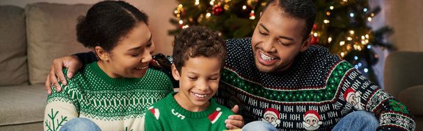 happy african american family in warm festive sweaters spending time together, Christmas, banner - Photo, Image