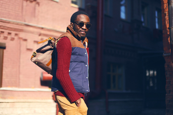 Outdoor fashion portrait of handsome stylish african man in even - Photo, Image