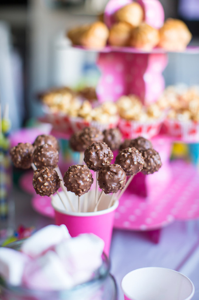 Chocolate cakepops on holiday dessert table at kid birthday party - Photo, Image