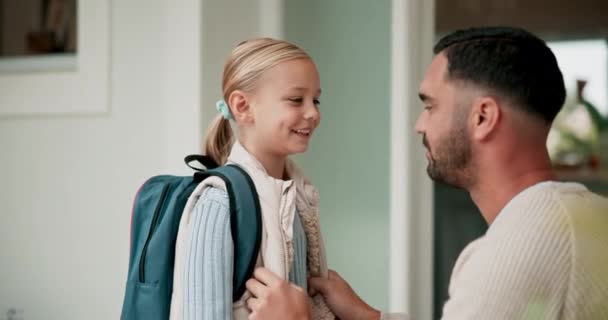 Father, kid and backpack for school, laughing at home and getting ready at front door in morning. Smile, dad and girl child with bag, excited for learning and development, study with love and support. - Footage, Video