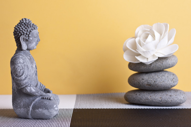 stone sitting buddha and frankincense - Foto, Bild