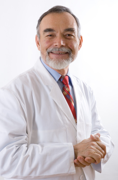 Caring doctor smiling - Foto, afbeelding