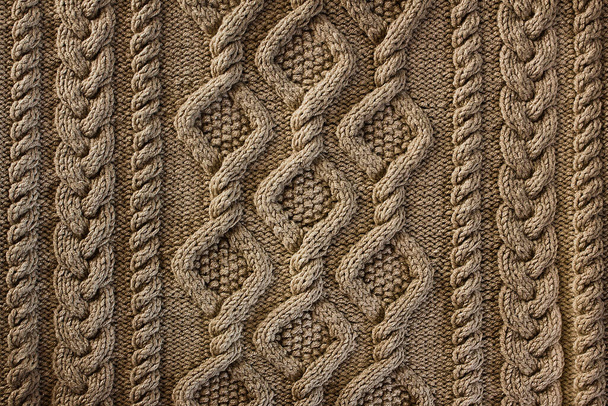 Béžová podkladová pletenina se vzorem. Detailní záběr na pletené Arany - Fotografie, Obrázek