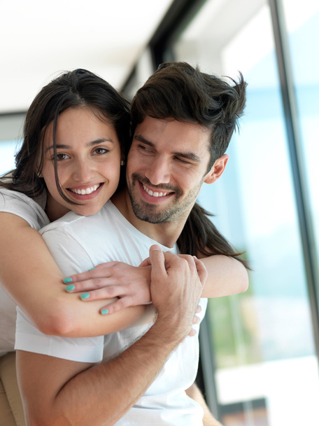 Relaxed young couple at home - Foto, Imagen