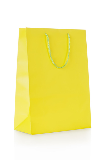 Yellow shopping bag in paper - 写真・画像