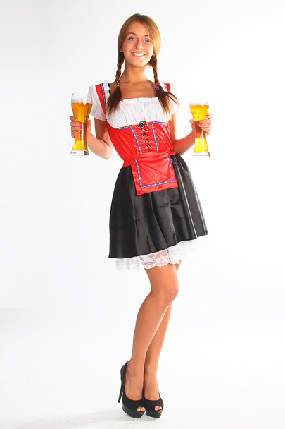 The girl in a traditional Bavarian dress - 写真・画像