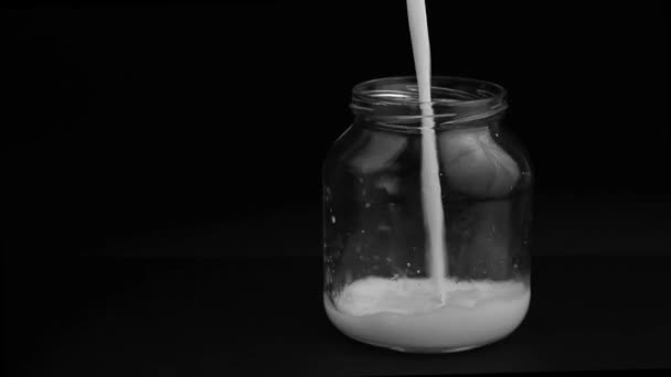 Milk pour into a glass jar - Footage, Video