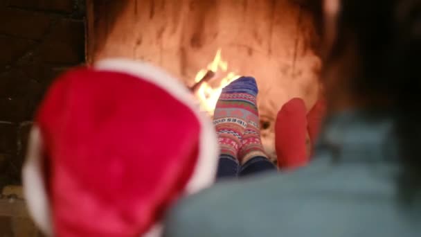 kids sitting by fireplace - Footage, Video