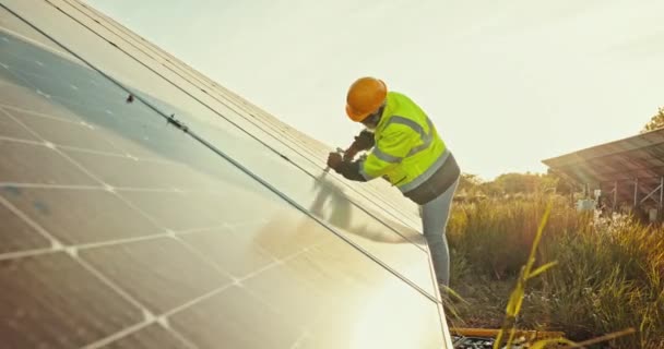Solar panels, engineering man and tools for maintenance, electrical repair and heating on farm in outdoor sun. Industry worker with wrench in photovoltaic grid installation, and sustainable solution. - Footage, Video