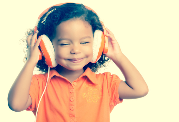 Small girl listening to music - Фото, зображення