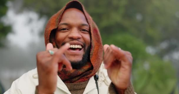 Portrait of black man in nature, shaka and camping on winter adventure, peace and calm. Relax, freedom and smile, happy hands sign and camper in forest for hiking in trees and travel holiday in woods. - Footage, Video