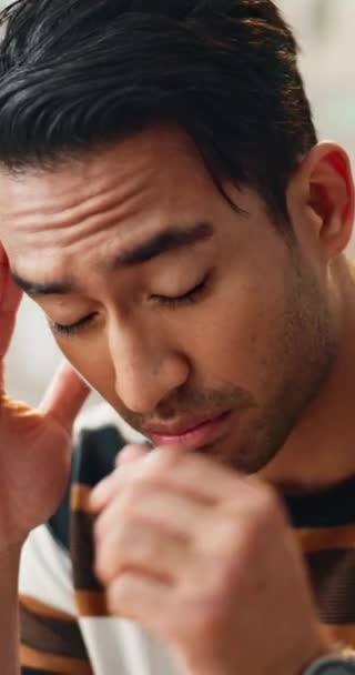 Asian man, headache and stress in mistake, brain fog or bankruptcy with anxiety or mental health at office. Closeup of frustrated or tired male person or employee with migraine in financial crisis. - Footage, Video