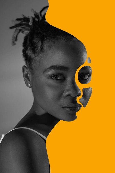 Plakat. Kolaż sztuki współczesnej. Monochromatyczny portret afro-afrykańskiej kobiety z abstrakcyjnymi pomarańczowymi oczami wyłożonymi kohlem. Pojęcie Miesiąca Czarnej Historii, praw obywatelskich, kultury, wolności i wolności. - Zdjęcie, obraz