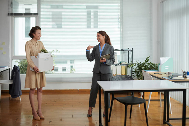 Smiling company manager showing workplace to new coworker - Photo, Image