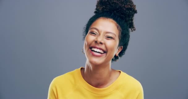Face, studio or happy woman laughing at comedy or crazy joke isolated on gray background. Freedom, funny gen z girl or silly female person with pride, goofy smile or joy to relax alone with humor. - Footage, Video