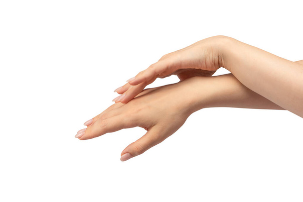Mani di donna isolate su sfondo bianco. Smalto per unghie nudo.  - Foto, immagini