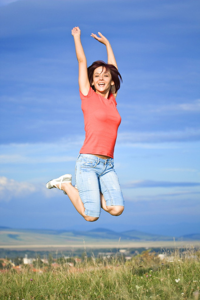jumping woman - Foto, afbeelding