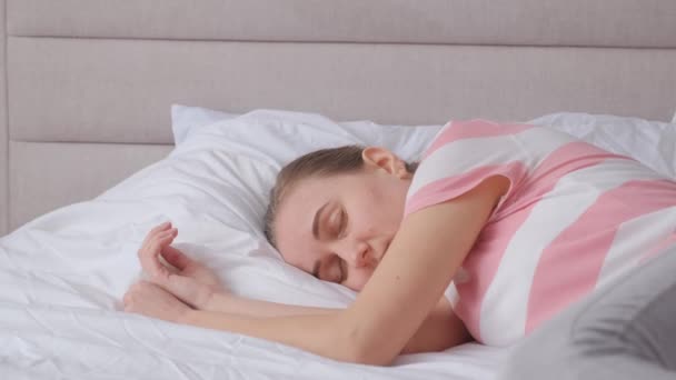 Upset depressed sick girl lying on bed in bedroom. Life crisis, insomnia, sleep disturbance. Depression or mental health problems. - Footage, Video