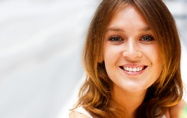 Closeup portrait of a beautiful young woman having a happy thoug - Photo, Image