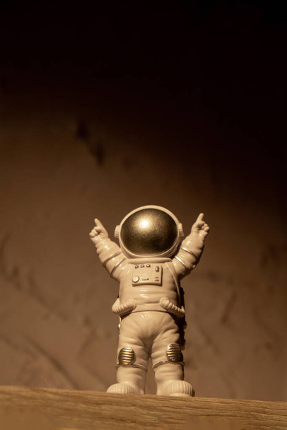 Plastic toy figure astronaut on moon concrete background Copy space. Concept of out of earth travel, private spaceman commercial flights. Space missions and Sustainability - Fotografie, Obrázek