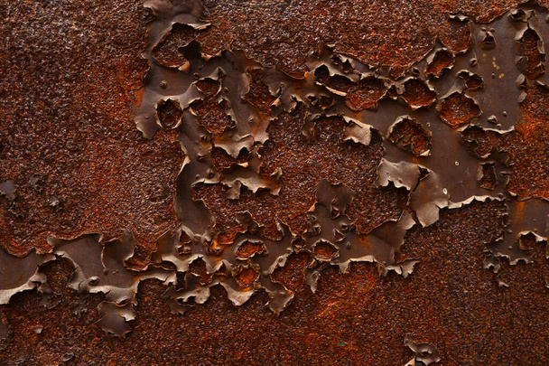 Фон ржавой металлической дыры, очищающей краску  - Фото, изображение