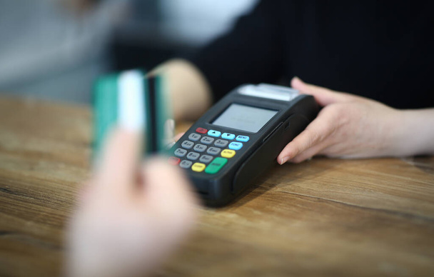 Digital Paying for Service via Payment Terminal. Hand with Credit Card Swipe on Machine. Electronic Money Transaction Checkout. Using Technology Device for Financial Operation Close-up Photography - Photo, Image