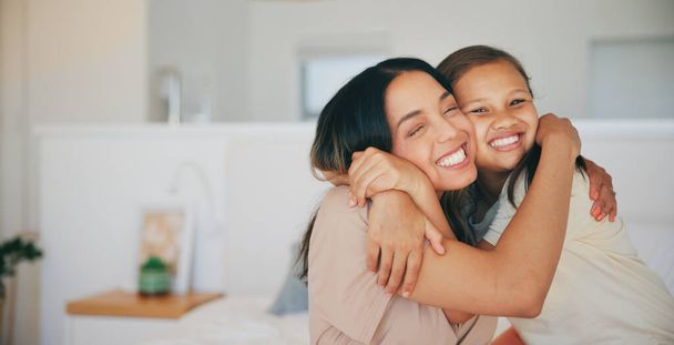 Face, smile and a mother hugging her daughter in the bedroom of their home in the morning together. Family, love and a happy young girl embracing her single parent while on a bed in their apartment. - Photo, Image