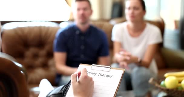 Troubled couple talking to counselor and complaining about bad relationship with husband. Married couple having counseling conversation about problem at therapy session - Footage, Video
