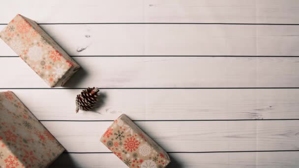 Pine cones and christmas presents on a white background.  - Footage, Video