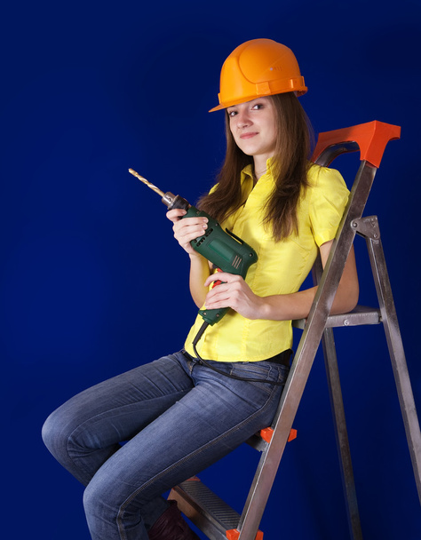 Female worker with drill - 写真・画像